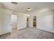 Spacious carpeted bedroom with closet and bathroom entrances at 9115 Canoga Canyon Ct # 103, Las Vegas, NV 89149