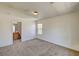 Neutral bedroom with carpet and a window; bathroom access is visible at 9115 Canoga Canyon Ct # 103, Las Vegas, NV 89149