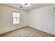 This bedroom has neutral carpet and a window that allows for ample natural light at 9115 Canoga Canyon Ct # 103, Las Vegas, NV 89149