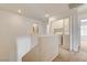 Hallway with laundry area featuring white washer and dryer next to storage cabinets at 9115 Canoga Canyon Ct # 103, Las Vegas, NV 89149