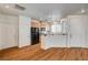 Kitchen with wooden floors, light wooden cabinets, recessed lighting and breakfast bar at 9115 Canoga Canyon Ct # 103, Las Vegas, NV 89149