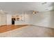 Large living room with a ceiling fan that opens to the kitchen at 9115 Canoga Canyon Ct # 103, Las Vegas, NV 89149