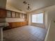 Bright dining area featuring built-in cabinets, tiled flooring, and a large window at 9693 Bighorn Island Ave, Las Vegas, NV 89148