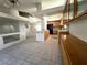 Open kitchen featuring an island, tiled flooring, oak cabinets and seamless access to living area at 9693 Bighorn Island Ave, Las Vegas, NV 89148