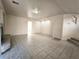 Spacious living room featuring tiled flooring, a fireplace, and neutral wall colors at 9693 Bighorn Island Ave, Las Vegas, NV 89148