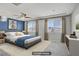 Spacious bedroom featuring a large window and stylish decor at 9784 Kodiak Island Ct, Las Vegas, NV 89141