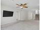 Large, open room featuring neutral carpet and multiple doorways leading to other rooms at 9784 Kodiak Island Ct, Las Vegas, NV 89141