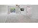 Bright bedroom with a sliding glass door to the backyard and neutral carpet at 9784 Kodiak Island Ct, Las Vegas, NV 89141