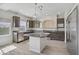 Modern kitchen with stainless steel appliances, granite countertops, and a large island at 9784 Kodiak Island Ct, Las Vegas, NV 89141