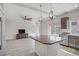 Open-concept kitchen with granite counters, stainless appliances, and a view to the living room at 9784 Kodiak Island Ct, Las Vegas, NV 89141