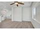 Spacious living room featuring hardwood floors, modern lighting, and an open floor plan at 9784 Kodiak Island Ct, Las Vegas, NV 89141