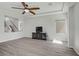 Stylish living room with hardwood floors and a flat screen TV at 9784 Kodiak Island Ct, Las Vegas, NV 89141