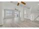 Bright living room featuring high ceilings, hardwood floors, and an abundance of light at 9784 Kodiak Island Ct, Las Vegas, NV 89141