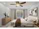 Tranquil main bedroom with hardwood floors, bright lighting, and serene backyard views at 9784 Kodiak Island Ct, Las Vegas, NV 89141