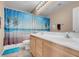 Bathroom featuring double vanity, shower with decorative curtain, and tile floors at 9909 Masked Duck Ave, Las Vegas, NV 89117