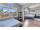 Bedroom features large window with neighborhood view and a closet with mirrored doors at 9909 Masked Duck Ave, Las Vegas, NV 89117