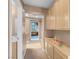 Bright hallway featuring ample storage and a glimpse of the backyard at 9909 Masked Duck Ave, Las Vegas, NV 89117