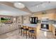 Bright, open kitchen features granite countertops, breakfast bar, and modern appliances at 9909 Masked Duck Ave, Las Vegas, NV 89117