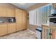 Spacious eat-in kitchen has natural light, bright cabinets and a granite countertop at 9909 Masked Duck Ave, Las Vegas, NV 89117