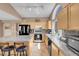 Large kitchen with granite counters, a central island, and modern stainless appliances at 9909 Masked Duck Ave, Las Vegas, NV 89117