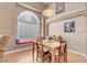 Cozy dining area with large window and built-in bench seating for relaxed meals at 9909 Masked Duck Ave, Las Vegas, NV 89117