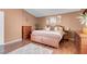 Well-appointed main bedroom with wooden furniture and comfortable bedding at 9909 Masked Duck Ave, Las Vegas, NV 89117