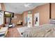 Spacious main bedroom with vaulted ceilings, a seating area, and backyard views at 9909 Masked Duck Ave, Las Vegas, NV 89117