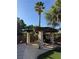 Covered patio with an outdoor dining set offering a comfortable space for entertaining and relaxation at 9909 Masked Duck Ave, Las Vegas, NV 89117