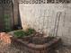 Corner of the backyard shows a small garden area with brick borders at , Las Vegas, NV 89128