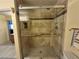 Walk-in shower with decorative tile, glass door, and handheld shower at , Las Vegas, NV 89128