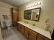 Bathroom with double sinks, tile floor, and wood cabinets at , Las Vegas, NV 89128