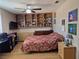 Bedroom with built in shelves, wood floor, and ceiling fan at , Las Vegas, NV 89128