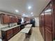 Spacious kitchen with wood cabinets, granite countertops, and a kitchen island at , Las Vegas, NV 89128