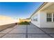 A neatly designed outdoor patio and grassy backyard enclosed by a block wall at , Las Vegas, NV 89166