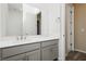 Bathroom with gray vanity, white countertop, and a well-lit mirror at , Las Vegas, NV 89166
