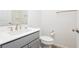 Bathroom featuring a gray vanity, white countertop, toilet and bronze hardware at , Las Vegas, NV 89166