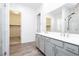 Primary bathroom with a glass shower, double sink vanity, and an open closet at , Las Vegas, NV 89166