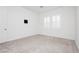 A bright bedroom features gray carpet, fresh paint, and shuttered windows at , Las Vegas, NV 89166