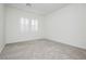 A bright bedroom features gray carpet, fresh paint, and shuttered windows at , Las Vegas, NV 89166