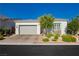 Charming single story home featuring a two car garage, desert landscaping, and bright stucco at , Las Vegas, NV 89166