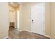 Home hallway featuring wood-style floors, with the front door and a bathroom in view at , Las Vegas, NV 89166
