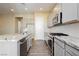 Kitchen with gray cabinets, stainless steel appliances, and an island with seating at , Las Vegas, NV 89166
