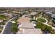 Aerial view of the home with a swimming pool, set in a neighborhood with city views beyond at 10349 Bressana Dr, Las Vegas, NV 89135