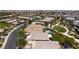 Expansive aerial view of a luxury neighborhood featuring multiple pools and professionally landscaped common areas at 10349 Bressana Dr, Las Vegas, NV 89135