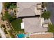 An aerial view showcases the home's roof, backyard, and outdoor putting green at 10349 Bressana Dr, Las Vegas, NV 89135