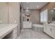 Spa-like bathroom with a soaking tub, double sinks, and modern finishes at 10349 Bressana Dr, Las Vegas, NV 89135
