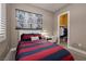 Cozy bedroom with themed decor, closet, and desk space, great for a retreat at 10349 Bressana Dr, Las Vegas, NV 89135