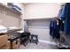 Walk-in closet with shelves, hanging rods, and ample storage space at 10349 Bressana Dr, Las Vegas, NV 89135