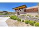 A stone-clad community entrance with desert landscaping and clear signage at 10349 Bressana Dr, Las Vegas, NV 89135