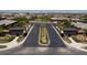 An inviting community entrance with dual gatehouses and meticulously maintained landscaping welcomes residents and visitors at 10349 Bressana Dr, Las Vegas, NV 89135